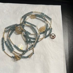 Set of 7 bracelets with blue stones and goldstone with animals